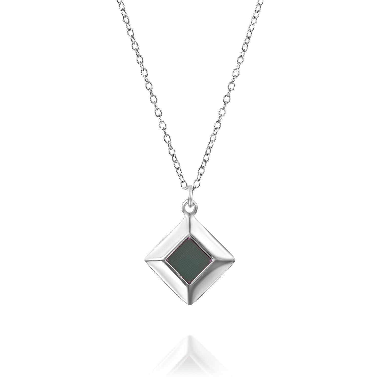 Silver necklace with square green pendant on a reflective surface.
